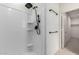 Updated bathroom featuring a modern shower with black fixtures and white tiled walls at 5013 S 112Th Ave, Tolleson, AZ 85353
