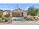 House exterior, showing front yard and garage at 5013 S 112Th Ave, Tolleson, AZ 85353