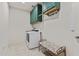 Laundry room with washer, dryer, and green cabinets at 5013 S 112Th Ave, Tolleson, AZ 85353