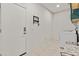Laundry room with washer, dryer, and exterior access at 5013 S 112Th Ave, Tolleson, AZ 85353