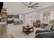 Open concept living room and kitchen with island at 5013 S 112Th Ave, Tolleson, AZ 85353