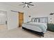 Spacious main bedroom with a barn door and stylish decor at 5013 S 112Th Ave, Tolleson, AZ 85353