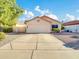 House exterior with a two-car garage and well-maintained front yard at 5455 E Fairfield St, Mesa, AZ 85205