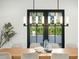 Elegant dining room with a long wooden table and modern chandelier at 5539 E Camelback Rd, Phoenix, AZ 85018