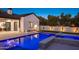 Luxury backyard oasis featuring a sparkling pool and spa at 5539 E Camelback Rd, Phoenix, AZ 85018