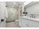 Modern bathroom with white vanity and glass shower at 6712 E Pershing Ave, Scottsdale, AZ 85254