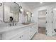 Double vanity bathroom with quartz countertop and walk-in closet at 6712 E Pershing Ave, Scottsdale, AZ 85254