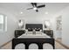 Main bedroom with king bed, ensuite bathroom and two nightstands at 6712 E Pershing Ave, Scottsdale, AZ 85254