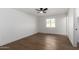 Bright bedroom with wood floors and ceiling fan at 6712 E Pershing Ave, Scottsdale, AZ 85254