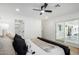 Bright bedroom with king bed, ceiling fan, and backyard access at 6712 E Pershing Ave, Scottsdale, AZ 85254