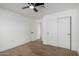 Bright bedroom with wood floors and ceiling fan at 6712 E Pershing Ave, Scottsdale, AZ 85254