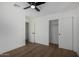 Bedroom with wood floors and sliding closet doors at 6712 E Pershing Ave, Scottsdale, AZ 85254