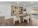 Light and bright dining room features a wooden table with seating for six at 6712 E Pershing Ave, Scottsdale, AZ 85254