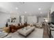 Spacious living area with hardwood floors, comfortable seating and large windows at 6712 E Pershing Ave, Scottsdale, AZ 85254