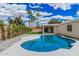 Inviting backyard pool surrounded by a spacious patio, green landscaping, privacy landscaping and a covered patio at 6712 E Pershing Ave, Scottsdale, AZ 85254