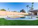 Relaxing kidney shaped pool with grassy backyard at 6712 E Pershing Ave, Scottsdale, AZ 85254