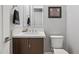 Modern bathroom with white vanity, toilet, and mirror at 6850 E Mcdowell Rd # 72, Scottsdale, AZ 85257