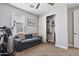 Bedroom offering a comfortable sofa, exercise bike, and closet storage at 6850 E Mcdowell Rd # 72, Scottsdale, AZ 85257