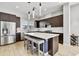 Spacious kitchen featuring island, stainless steel appliances, and dark cabinetry at 6850 E Mcdowell Rd # 72, Scottsdale, AZ 85257