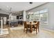 Open concept kitchen and dining area with wood flooring and breakfast table at 6850 E Mcdowell Rd # 72, Scottsdale, AZ 85257
