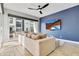 Bright living area with large TV, comfortable seating, and sliding glass doors at 6850 E Mcdowell Rd # 72, Scottsdale, AZ 85257