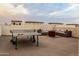 Private rooftop deck with seating area, fire pit, and ping pong table at 6850 E Mcdowell Rd # 72, Scottsdale, AZ 85257