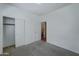 Bright bedroom with neutral walls and carpet at 7037 W Pontiac Dr, Glendale, AZ 85308