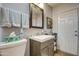 Bathroom with vanity, toilet and a large mirror at 7750 E Broadway Rd # 770, Mesa, AZ 85208