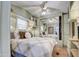 Spacious bedroom with built-in mirrored wardrobe and ceiling fan at 7750 E Broadway Rd # 770, Mesa, AZ 85208