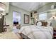 Main bedroom with a cozy bed and access to another room at 7750 E Broadway Rd # 770, Mesa, AZ 85208