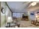 Living room with ample seating and a large TV at 7750 E Broadway Rd # 770, Mesa, AZ 85208