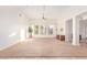 Bright living room featuring large windows and carpet flooring at 8451 W Daley Ln, Peoria, AZ 85383