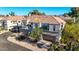Inviting townhouse featuring a two-car garage, mature landscaping, and a comfortable suburban setting at 8989 N Gainey Center Dr # 222, Scottsdale, AZ 85258