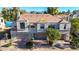 Charming townhouse with a two-car garage, complemented by mature trees and desert landscaping at 8989 N Gainey Center Dr # 222, Scottsdale, AZ 85258