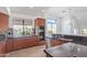 Modern kitchen with granite counters, stainless steel appliances, and ample cabinetry at 8989 N Gainey Center Dr # 222, Scottsdale, AZ 85258