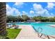 Community pool with lounge chairs and patio area at 8989 N Gainey Center Dr # 222, Scottsdale, AZ 85258