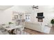 Combined dining and living room with hardwood floors, marble table, and kitchen view at 9412 N 33Rd Way, Phoenix, AZ 85028