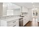 White kitchen with quartz countertops and subway tile backsplash at 9412 N 33Rd Way, Phoenix, AZ 85028