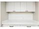 Laundry room with white cabinets and quartz countertop at 9412 N 33Rd Way, Phoenix, AZ 85028