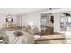 Spacious living area with hardwood floors, plush seating, and views to dining area at 9412 N 33Rd Way, Phoenix, AZ 85028