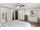 Main bedroom with wood floors, ensuite bathroom, and walk-in closet at 9412 N 33Rd Way, Phoenix, AZ 85028