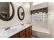 A bright bathroom with a double sink vanity, soaking tub, and plenty of counter space at 10245 W Jessie Ln, Peoria, AZ 85383