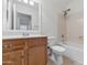 Clean bathroom with wood vanity, bathtub and shower at 10245 W Jessie Ln, Peoria, AZ 85383