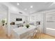 Modern kitchen with white cabinets, marble island, and stainless steel appliances at 10245 W Jessie Ln, Peoria, AZ 85383