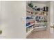 Well-organized pantry with ample shelving for storage at 10245 W Jessie Ln, Peoria, AZ 85383