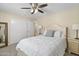 Bedroom with ceiling fan and large mirror at 10537 W Prairie Hills Cir, Sun City, AZ 85351