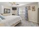 Bedroom with ceiling fan and window coverings at 10537 W Prairie Hills Cir, Sun City, AZ 85351