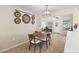 Dining area with hardwood floors and view to living room at 10537 W Prairie Hills Cir, Sun City, AZ 85351