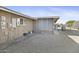 View of home's exterior showing electrical panel and screened patio at 10537 W Prairie Hills Cir, Sun City, AZ 85351