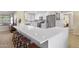 L-Shaped kitchen island with white quartz countertop at 10537 W Prairie Hills Cir, Sun City, AZ 85351